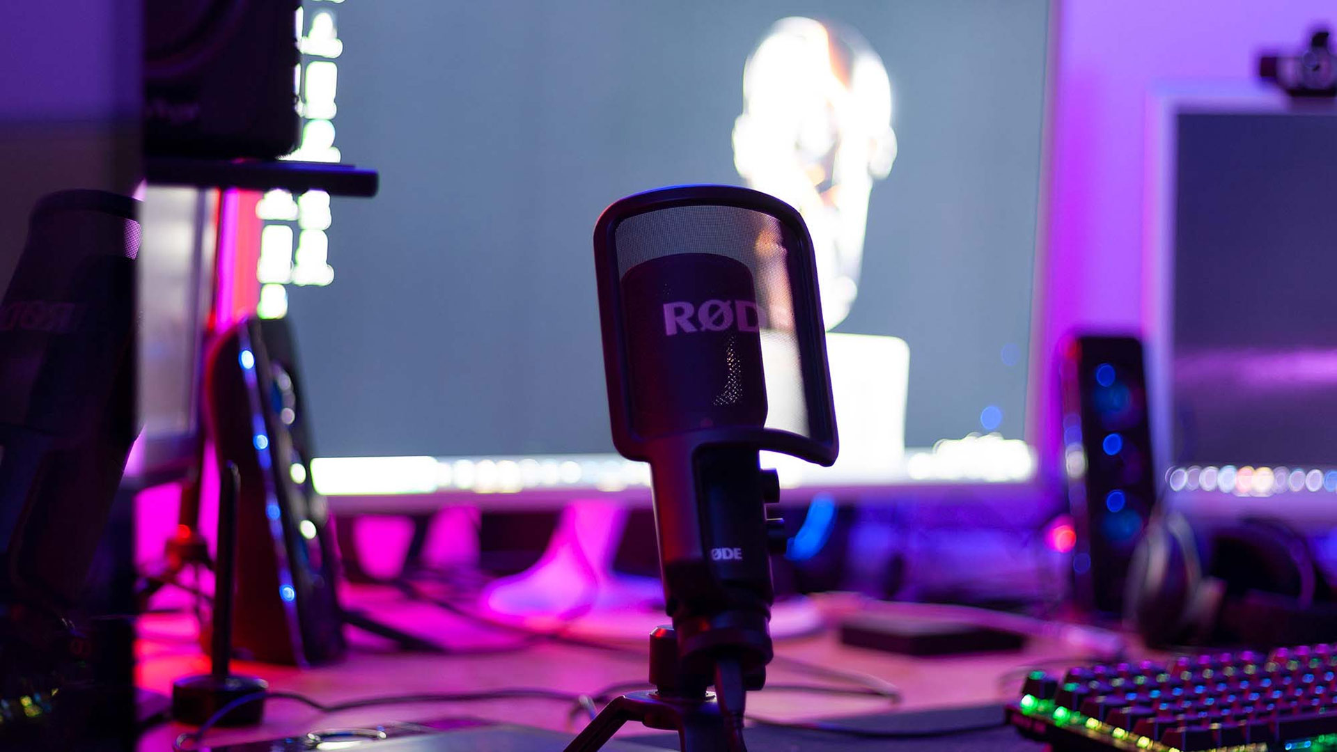 RØDE NT-USB Microphone placed on a desk.